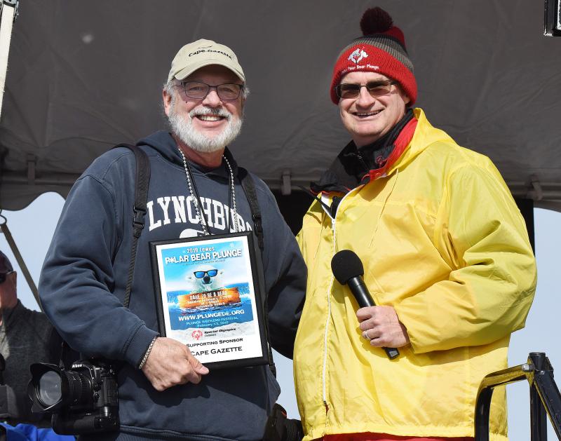 Cape Gazette photographer Dan Cook accepts a sponsorship award from SODE Director of Media Relations and Program Innovations Jon Buzby. CHUCK SNYDER PHOTO